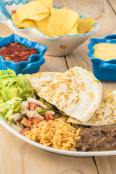 Spinach mushroom quesadillas with refried beans and rice.