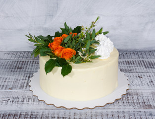 cream cheese vanilla wedding cake with orange roses