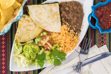 Spinach mushroom quesadillas with refried beans and rice.
