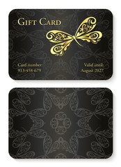 Luxury black gift card with dragonfly ornament. Front side with golden embossed relief, back side with circle ornament decoration
