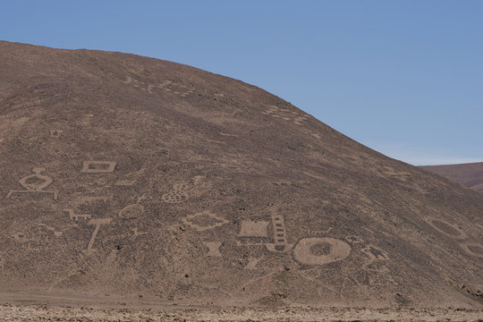 Large group of ancient petroglyphs on the hillsides at Cerro Pintados in the Atacama Desert in the Tarapaca Region of northern Chile. 