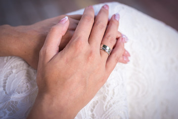 the bride's hand with the ring