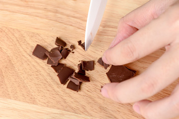 chocolate on a chopping board on wooden table 
