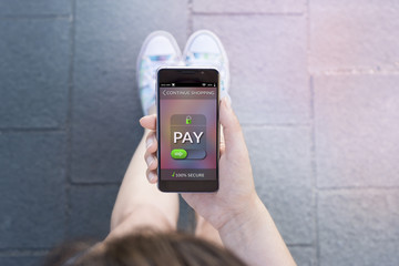 Woman using contemporary modern smartphone to make an online payment. Shopping online concept
