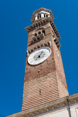 Fototapeta na wymiar Torre dei Lamberti, the clock tower in Piazza delle Erbe. Verona, Italy