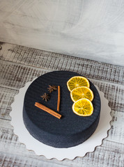 black chocolate velour cake with dried oranges and cinnamon