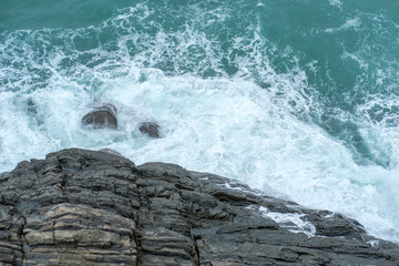 Sea waves crashing on the rock.