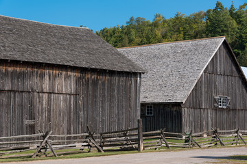 Naklejka premium old wooden barns in pioneer village