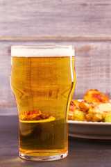 Beer and chicken wings buffalo with cheese dip, vertical