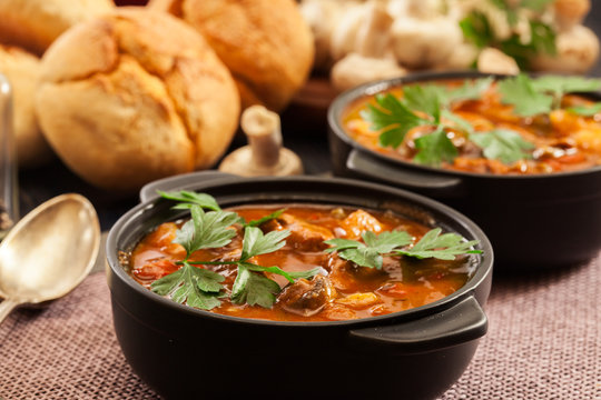 Stew soup with meat, potatoes, mushrooms and red pepper
