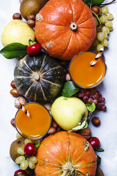 Pumpkin juice, autumn harvest of vegetables, fruits and nuts, thanksgiving concept, top view