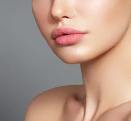 Fotobehang Sexy plump full lips. Close-up face detail. Perfect natural lip makeup. Close up photo with beautiful female face © looking2thesky