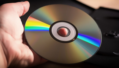 DVD disc in hand