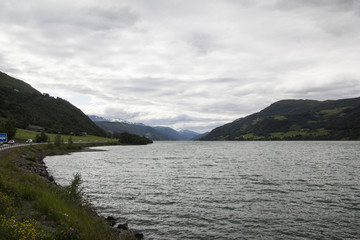 Fototapeta na wymiar View of a lake with mountain in background