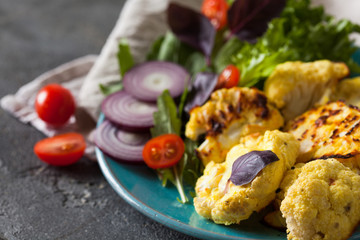 Vegetarian roasted cauliflower with fresh salad