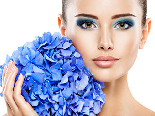 Portrait of young beautiful woman with a healthy clean skin of the face