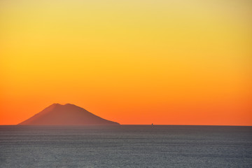 sunset of the volcano Stromboli seen from Tropea