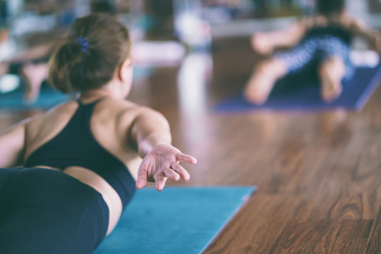Group of girls to exercise, yoga in the studio