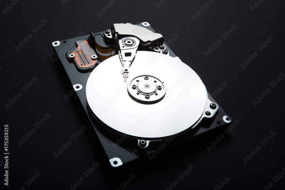 Poster close up of disassemble hard drive from the personal computer, hdd with mirror effect.