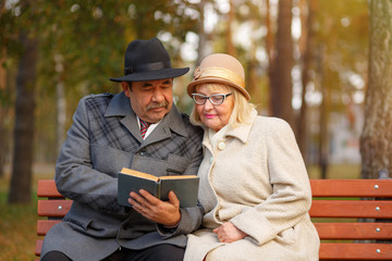 Senior couple reading book