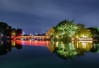 Fototapeta premium Landmark of red bridge Ho Hoan Kiem, lake of the returned sword at night