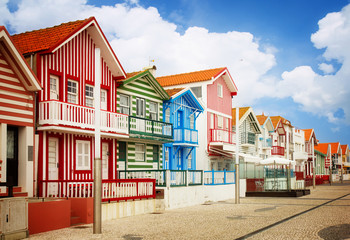 Fototapeta na wymiar street with typical striped houses Costa Nova, Aveiro, Portugal, retro toned