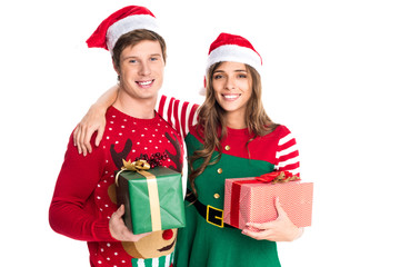 couple in santa hats with gifts