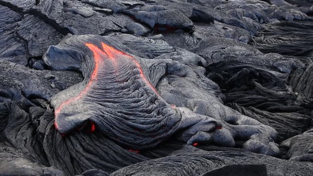 Red hot volcanic lava flowing in Hawaii