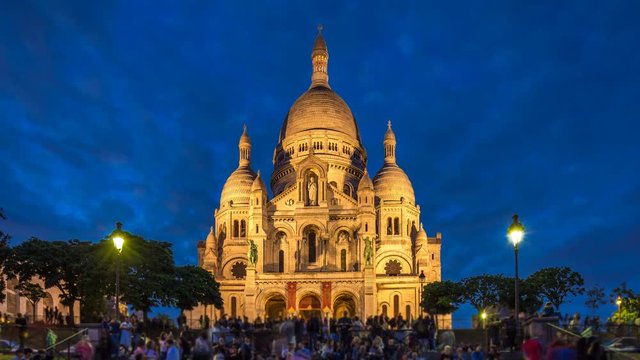 Frontal view of Sacre coeur Sacred Heart cathedral day to night timelapse. Paris, France
