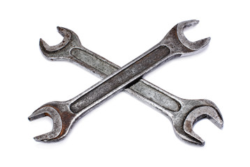 Crossed wrenches on white background