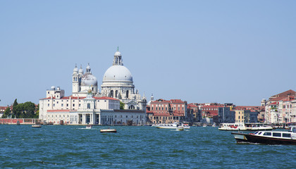 Fototapeta na wymiar Grand Canal and Basilica Santa Maria della Salute in Venice on a bright day.