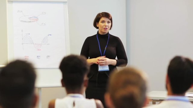 businesswoman with charts at business conference