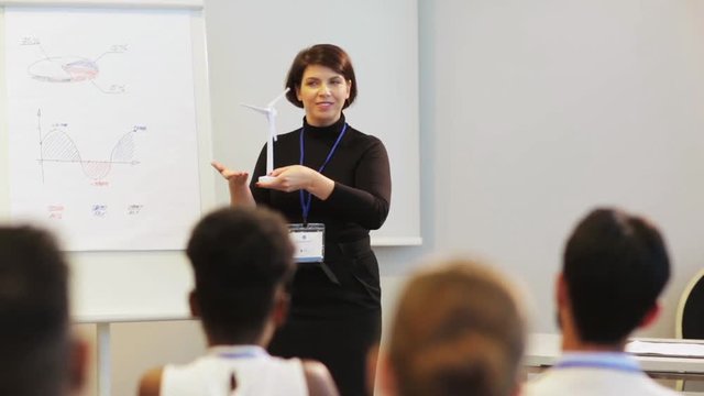 speaker with wind turbine at business conference