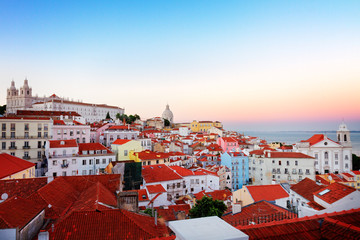 view of Alfama old town district at pink sunset, Lisbon, Portugal, retro toned
