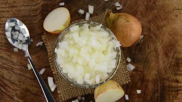 Fresh made White onions (chopped) (seamless loopable; 4K)