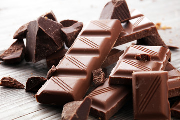 Dark Chocolate chunks and stacked broken chocolate bar.