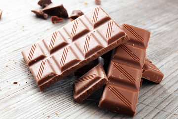 Dark Chocolate chunks and stacked broken chocolate bar.