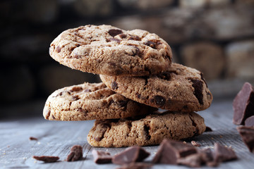 Chocolate cookies on wooden table. Chocolate chip cookies shot.