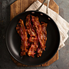 Cooked bacon on a skillet