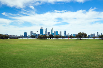 The Perth city skyline viewed across Sir Jame Mitchell Park in South Perth, Western Australia. - obrazy, fototapety, plakaty