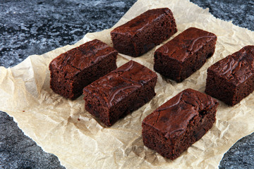 homemade chocolate brownies on grey vintage background, chocolate cake concept