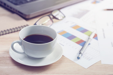 close-up cup of coffee on the desk businessman