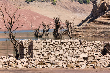 Ancient village engulfed in Mansilla de la Sierra, Spain, reappearing due to the persistent drought