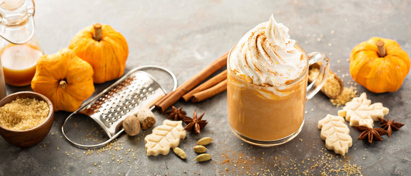 Pumpkin spice latte in a glass mug
