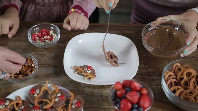 Three generation family making chocolate cookies