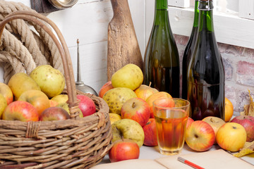 organic fresh apples with bottle of Normandy cider