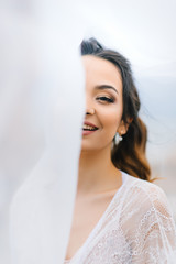 bride in her underwear and a dressing gown