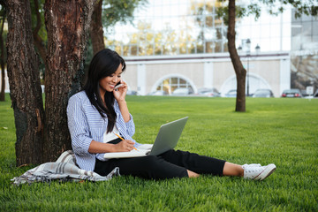 Portrait of a young smiling asian woman student