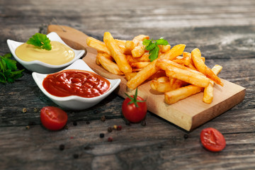 French fries with mayonnaise and tomato sauce