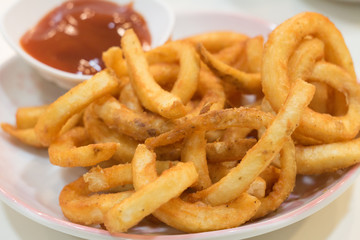 Homemade fast food portion of french fries with Tomato sauces